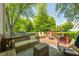 A charming back deck with comfortable seating, lush greenery, and a peaceful outdoor setting at 6374 Timberbluff Cir, Avon, IN 46123