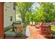 Relaxing back deck with ample seating, a cozy fire pit, and a picturesque backyard view at 6374 Timberbluff Cir, Avon, IN 46123