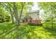 Expansive backyard featuring a deck, mature trees, and plenty of green space at 6374 Timberbluff Cir, Avon, IN 46123