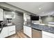 Bright basement bar with white cabinetry, stainless steel appliances, and a modern aesthetic at 6374 Timberbluff Cir, Avon, IN 46123