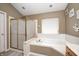 This bathroom features a soaking tub with a separate shower and tile flooring at 6374 Timberbluff Cir, Avon, IN 46123