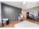 This is a bedroom with a decorative accent wall, ceiling fan, and hardwood floors at 6374 Timberbluff Cir, Avon, IN 46123