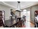 Formal dining room features hardwood floors, large windows with bright light and neutral paint at 6374 Timberbluff Cir, Avon, IN 46123