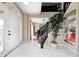 Bright foyer with white marble floors, a grand staircase, and a view into the adjacent dining room at 6374 Timberbluff Cir, Avon, IN 46123