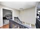 Upstairs hallway with hardwood floors overlooks the entry and a glimpse into a bedroom at 6374 Timberbluff Cir, Avon, IN 46123