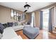 Cozy living room with hardwood floors, a ceiling fan, stylish furniture, and plenty of natural light at 6374 Timberbluff Cir, Avon, IN 46123