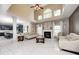 Spacious living room with marble floors, fireplace, soaring ceilings, and open layout to adjacent rooms at 6374 Timberbluff Cir, Avon, IN 46123