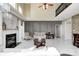 Elegant living room showcasing a fireplace, high ceilings, stylish furniture, and sophisticated decor at 6374 Timberbluff Cir, Avon, IN 46123