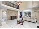 Open-concept living space with marble floors, designer furnishings, and seamless flow to the kitchen at 6374 Timberbluff Cir, Avon, IN 46123