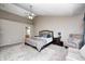 A spacious main bedroom features a ceiling fan and comfortable seating area at 6374 Timberbluff Cir, Avon, IN 46123