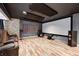 A home theater featuring leather seating, a projector screen, and a sound system at 6374 Timberbluff Cir, Avon, IN 46123