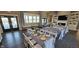 Well-lit common room with elegant table settings, comfortable seating, and large windows overlooking outdoor spaces at 6403 Yuma Ct, Whitestown, IN 46075