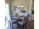 Elegant dining area with a round table, stylish chairs, and a modern chandelier at 6403 Yuma Ct, Whitestown, IN 46075