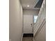 Bright entryway featuring a classic white front door and elegant staircase at 6403 Yuma Ct, Whitestown, IN 46075