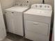 Laundry room featuring a white Whirlpool dryer and a white Maytag washing machine at 6403 Yuma Ct, Whitestown, IN 46075
