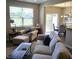 Bright living room with a cozy armchair, a plush sofa, and view to outdoor space at 6403 Yuma Ct, Whitestown, IN 46075