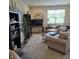 Spacious living area with a large window, neutral decor, and ample seating at 6403 Yuma Ct, Whitestown, IN 46075