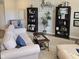 Inviting living room with bookshelves, a comfortable sofa, and elegant decor at 6403 Yuma Ct, Whitestown, IN 46075