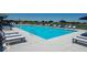 Sparkling pool with lounge chairs, umbrellas, and views of the surrounding greenery for a refreshing escape at 6403 Yuma Ct, Whitestown, IN 46075