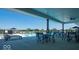Relaxing community pool area with lounge chairs, tables, and umbrellas for a perfect outdoor experience at 6403 Yuma Ct, Whitestown, IN 46075