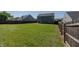 Expansive backyard enclosed by a wooden fence, offering privacy and ample space at 6491 Enclave Blvd, Greenwood, IN 46143