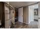 The basement has modern gray wood-look floors and the hot water heater is conveniently located near a full bathroom at 6491 Enclave Blvd, Greenwood, IN 46143