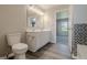 Bathroom featuring a double vanity, modern finishes, tile flooring and tub at 6491 Enclave Blvd, Greenwood, IN 46143