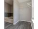 Bright bathroom features a tub with decorative backsplash and an organizing rack at 6491 Enclave Blvd, Greenwood, IN 46143
