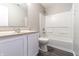 Bathroom with white cabinets and fixtures, plus a shower over tub at 6491 Enclave Blvd, Greenwood, IN 46143