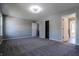 Spacious bedroom with carpet, and three doorway entries at 6491 Enclave Blvd, Greenwood, IN 46143