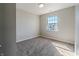 Carpeted bedroom with neutral paint, a window, and lots of natural light at 6491 Enclave Blvd, Greenwood, IN 46143