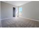 Bedroom with carpeted floor and walls painted in neutral colors, and a closet at 6491 Enclave Blvd, Greenwood, IN 46143