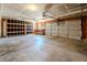 Ample garage features an automatic door, shelving and ready to store your vehicles at 6491 Enclave Blvd, Greenwood, IN 46143