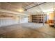 Spacious garage with shelving units and an automatic door opener awaits customization at 6491 Enclave Blvd, Greenwood, IN 46143