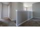 Hallway with plush carpet, neutral walls, and white trim at 6491 Enclave Blvd, Greenwood, IN 46143