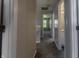 Hallway with neutral paint, doors, and carpeted floor at 6491 Enclave Blvd, Greenwood, IN 46143