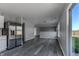 The kitchen flows into a dining area that features gray wood-look floors and views of the backyard at 6491 Enclave Blvd, Greenwood, IN 46143