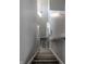 Looking down on gray wood-look floors and a modern white stairway at 6491 Enclave Blvd, Greenwood, IN 46143