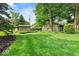 Green backyard featuring a lush lawn and a shed in a serene setting at 665 Spring Hills Dr, Zionsville, IN 46077