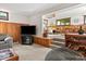 Finished basement with a lounge area and adjacent dining space, featuring wood accents at 665 Spring Hills Dr, Zionsville, IN 46077