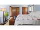 Inviting bedroom with soft blue walls, featuring cozy bedding and natural light from the window at 665 Spring Hills Dr, Zionsville, IN 46077