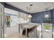 Charming breakfast nook with built-in seating, pendant lighting, and backyard views at 665 Spring Hills Dr, Zionsville, IN 46077