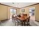 Traditional dining room featuring a wood table, chandelier, and large sliding glass door at 665 Spring Hills Dr, Zionsville, IN 46077