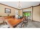 Bright dining room with traditional wooden furniture, chandelier, and natural lighting at 665 Spring Hills Dr, Zionsville, IN 46077