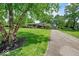 Traditional home with long driveway, lush lawn and mature trees at 665 Spring Hills Dr, Zionsville, IN 46077