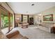 Spacious living room featuring a sliding glass door, comfortable seating, and ample natural light at 665 Spring Hills Dr, Zionsville, IN 46077