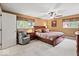 Comfortable main bedroom with ceiling fan, natural light, and neutral color scheme at 665 Spring Hills Dr, Zionsville, IN 46077