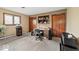 Functional office space with built-in shelves, a large window, and neutral tones at 665 Spring Hills Dr, Zionsville, IN 46077
