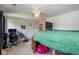 Cozy bedroom featuring comfortable bed, ceiling fan, and study area with desk and monitor at 6683 School Branch Dr, Brownsburg, IN 46112