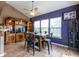 Dining area with modern lighting, a vaulted ceiling, and an open view of the kitchen at 6683 School Branch Dr, Brownsburg, IN 46112